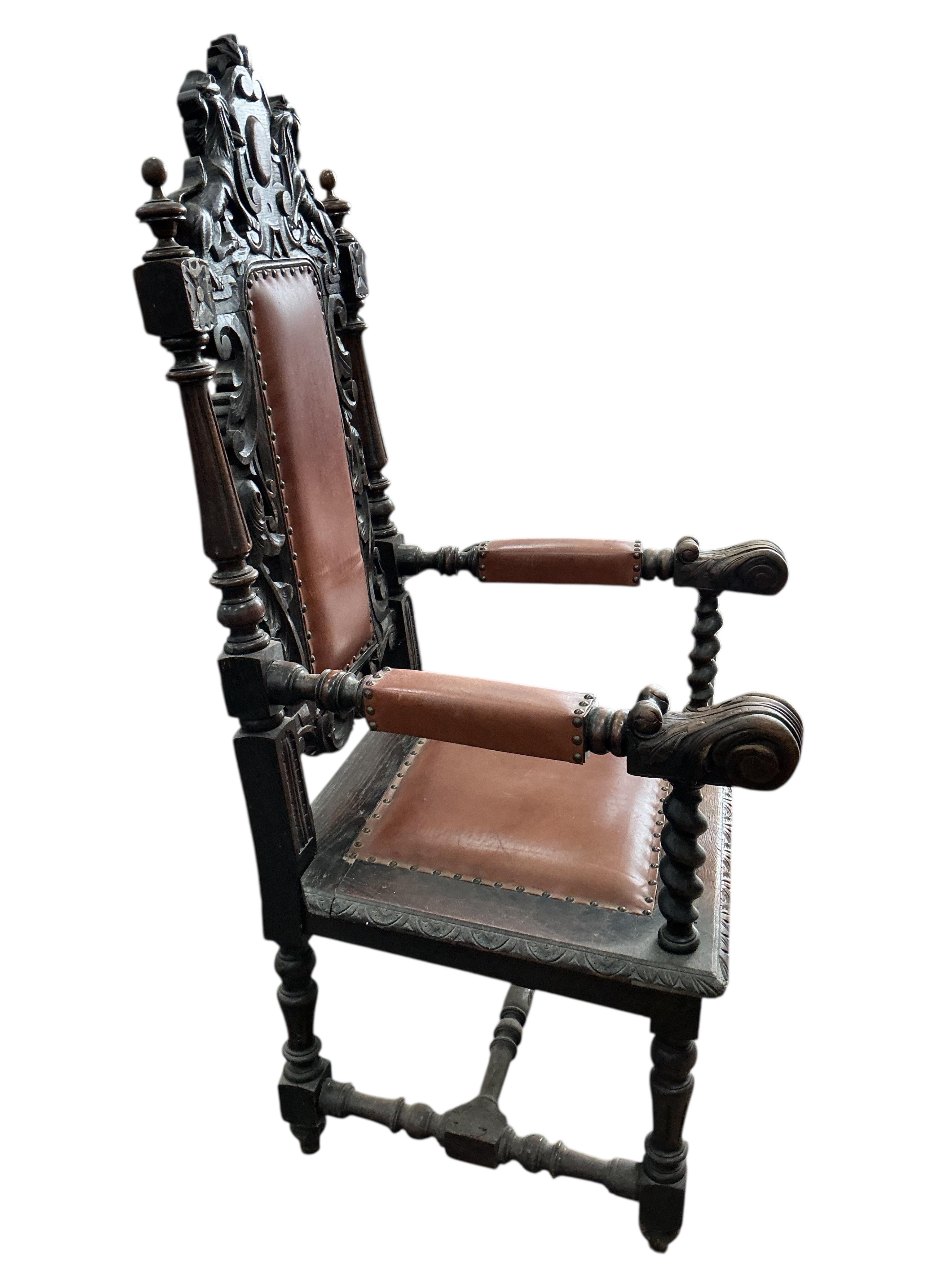 A late Victorian carved oak elbow chair, width 64cm, depth 62cm, height 136cm